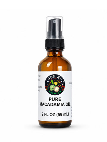 Elgon Nuts pure macadamia hair and skin oil in a 2 fl oz amber glass spray bottle with black pump and white label.