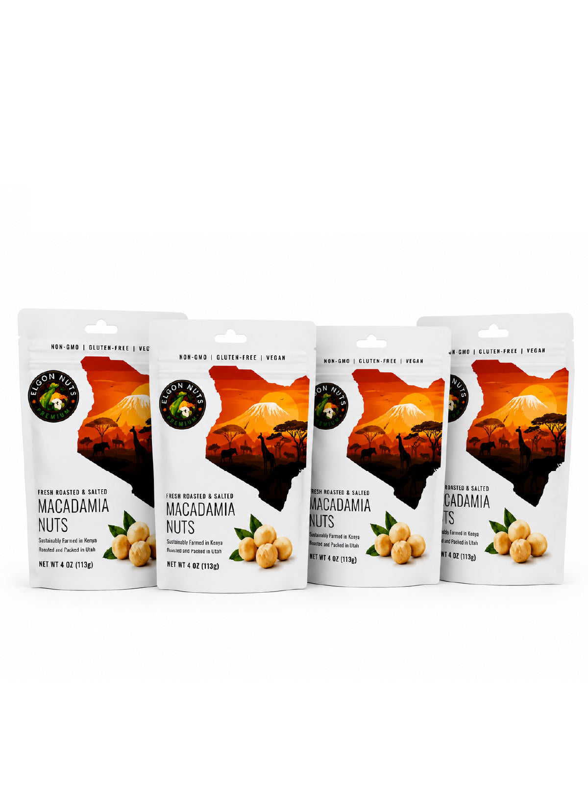 Four 4 oz bags of Elgon Nuts roasted and salted macadamia nuts displayed against a white background.