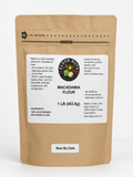 A 1 lb stand-up kraft paper pouch of Egon Nut's Macadamia Flour, featuring a white label with product details