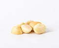 Style 4L raw macadamia nuts featuring larger halves and pieces on a white background.