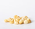 Style 5 raw macadamia nuts featuring small and medium broken nut pieces on a white background.