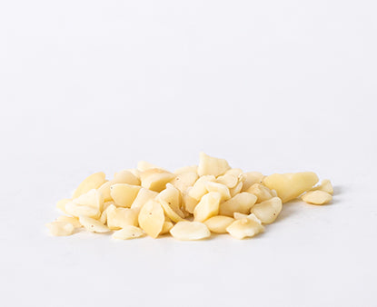 Style 6 raw macadamia nuts featuring small chopped macadamia pieces on a white background.